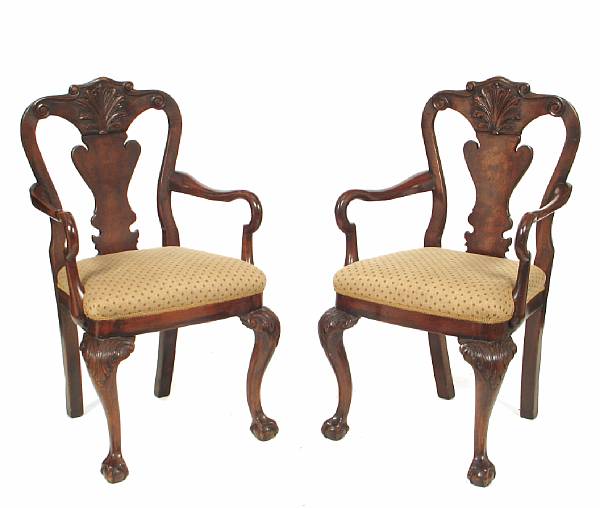 Appraisal: A pair of George I style walnut armchairs with ball