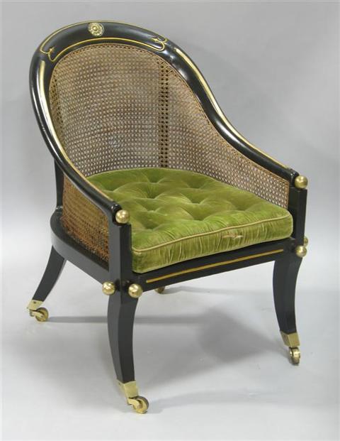 Appraisal: REGENCY STYLE EBONIZED GILT CANED TUB CHAIR Partially composed of