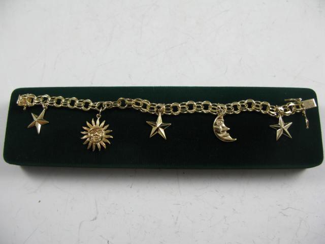 Appraisal: KT Gold Charm Bracelet w Charms with celestial theme charms