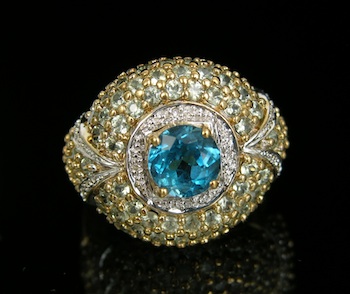 Appraisal: A Topaz and Diamond Dome Ring k yellow gold ring