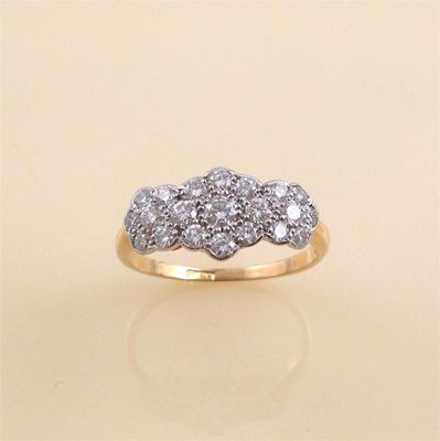 Appraisal: A diamond set triple cluster ring set throughout with brilliant