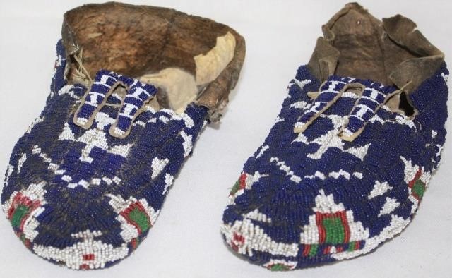 Appraisal: PAIR OF LATE TH CENTURY CENTRAL PLAINS BEADEDMOCCASINS DEEP BLUE