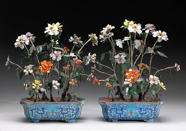 Appraisal: A pair of hardstone flowering trees mounted in polychrome enameled