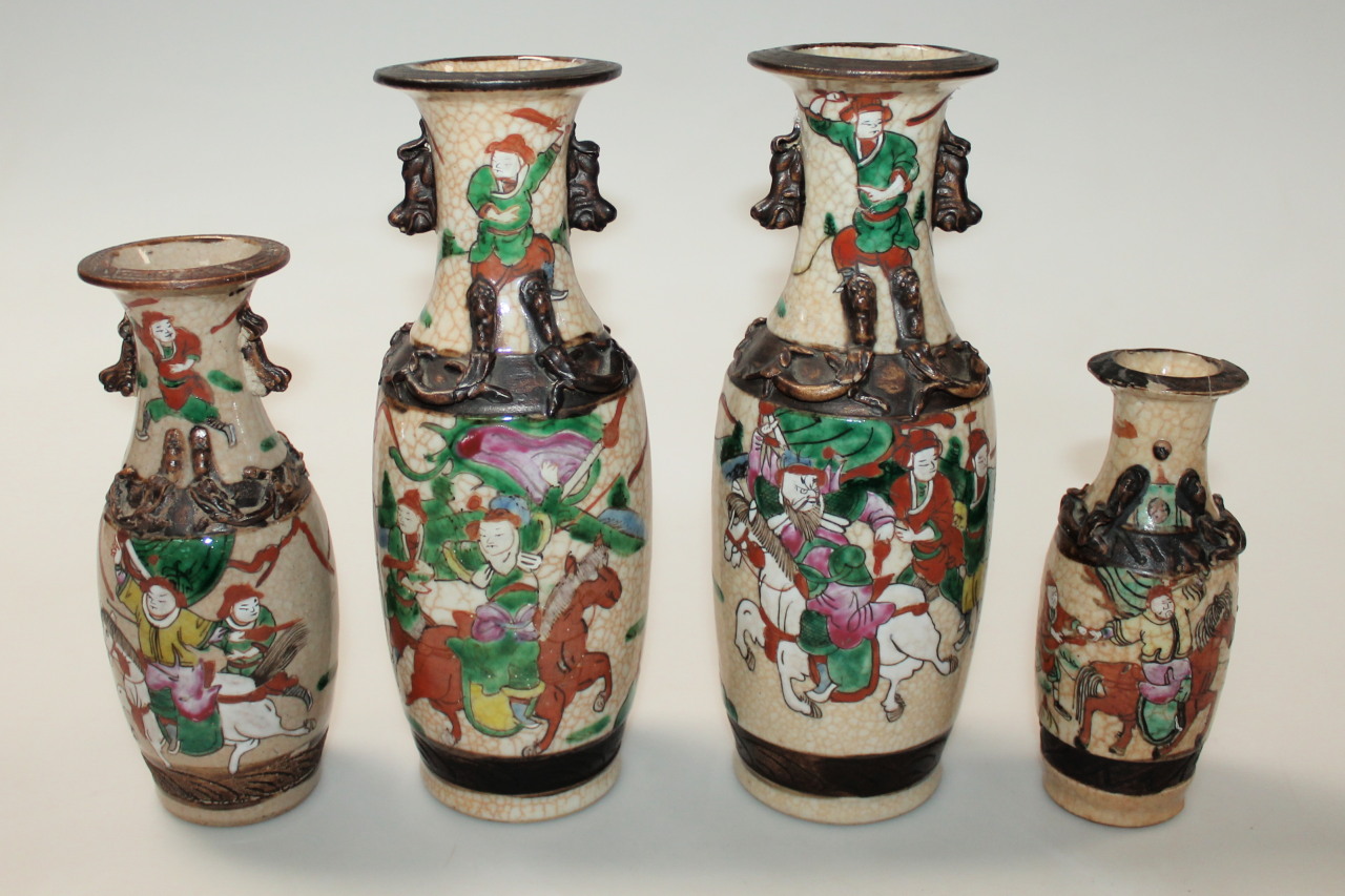 Appraisal: A pair of Cantonese earthenware vases with raised folded bandings