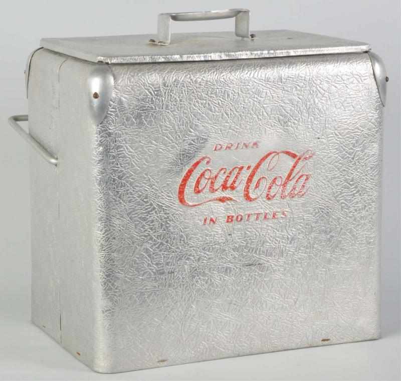 Appraisal: Aluminum Coca-Cola Picnic Cooler Interesting texture and finish with medium