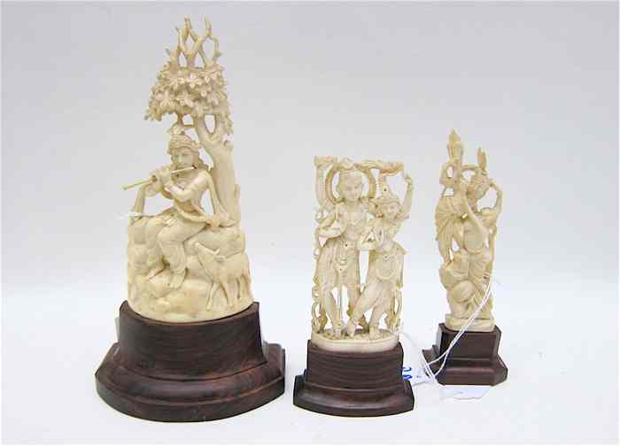 Appraisal: THREE HAND CARVED IVORY FIGURES from India the first a