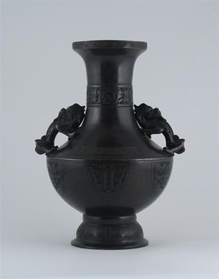 Appraisal: A Chinese bronze vase the body with shield-shaped panels the