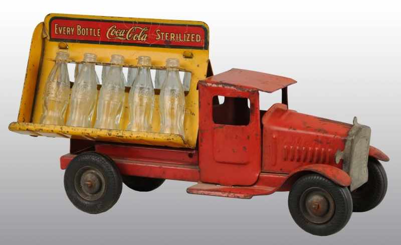 Appraisal: Pressed Steel Coca-Cola Truck Description Includes bottles With rubber wheels