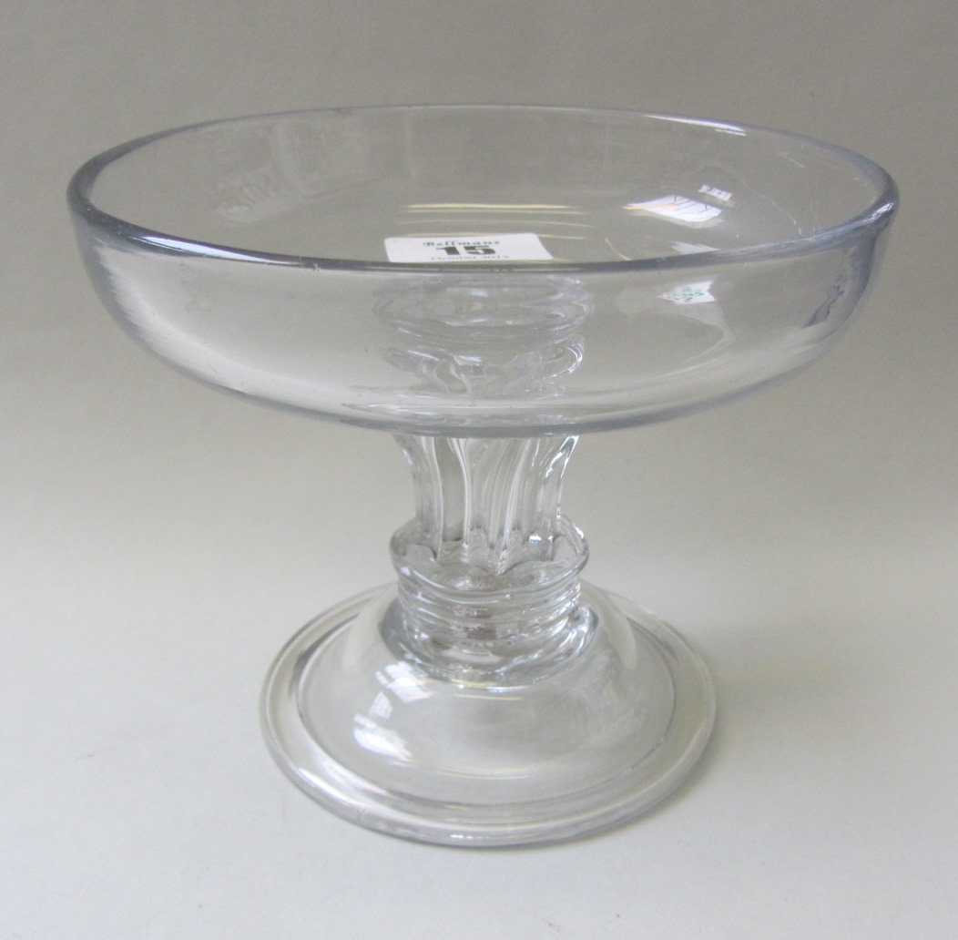 Appraisal: A glass sweetmeat mid th century the circular bowl raised