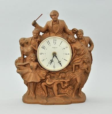 Appraisal: A Vintage Figural Clock A cast metal decorative clock with