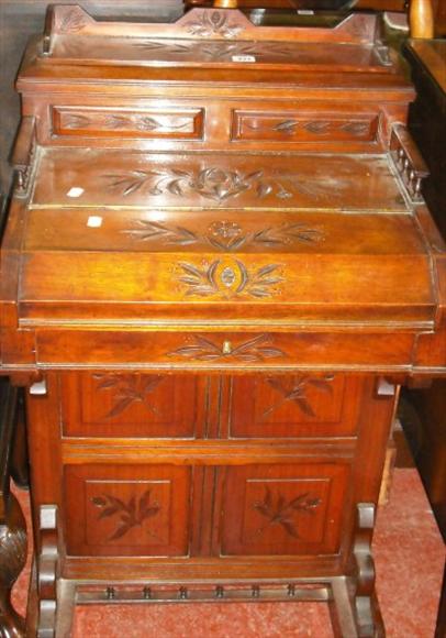 Appraisal: A Victorian carved walnut Davenport desk