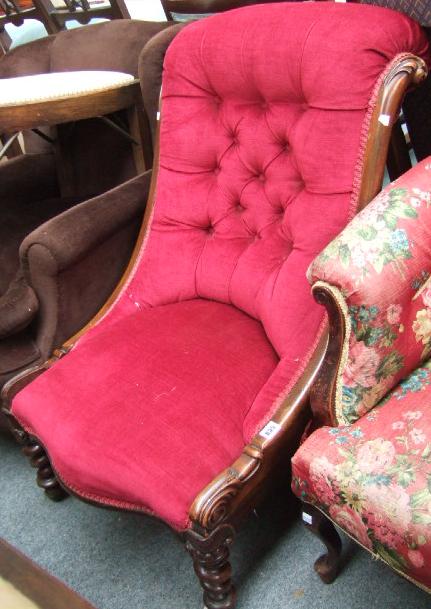 Appraisal: A Victorian walnut framed scroll back nursing chair raised on