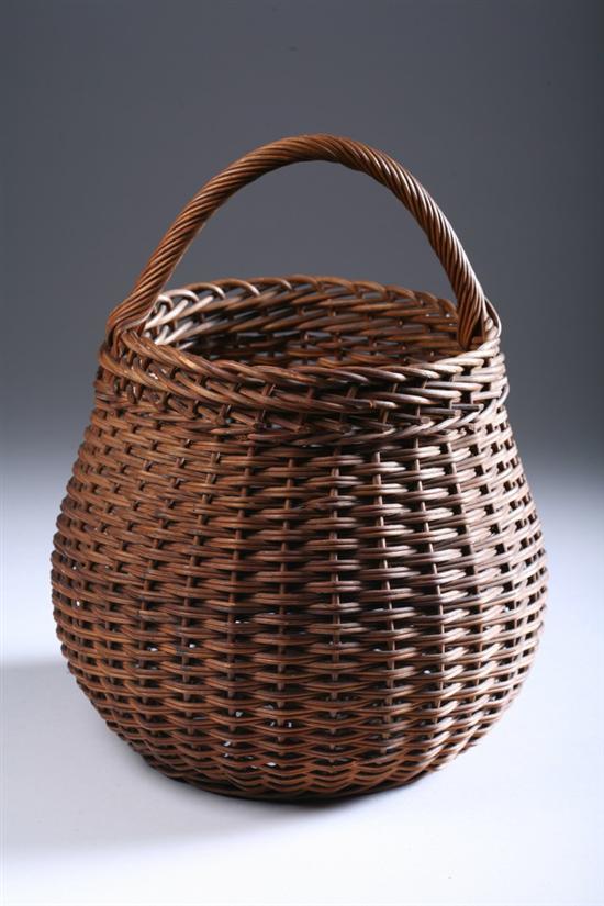 Appraisal: AMERICAN POT BELLY BASKET early th century Wooden strap handle