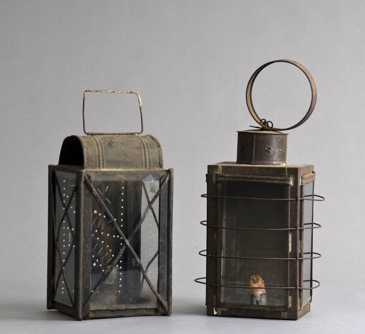 Appraisal: TWO PUNCHED TIN AND GLASS LANTERNS Height inches