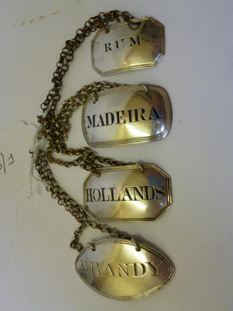 Appraisal: A COLLECTION OF FOUR BOTTLE TICKETS comprising Hollands maker E