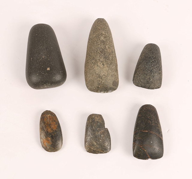 Appraisal: A COLLECTION OF SIX POSSIBLY NIGERIAN STONE AXE HEADS of