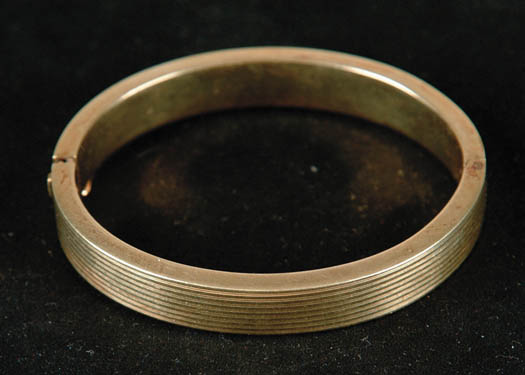 Appraisal: KT YELLOW GOLD BANGLE BRACELET Hinged design marked with a