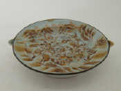 Appraisal: An early th century Chinese ceramic heated feeding plate with