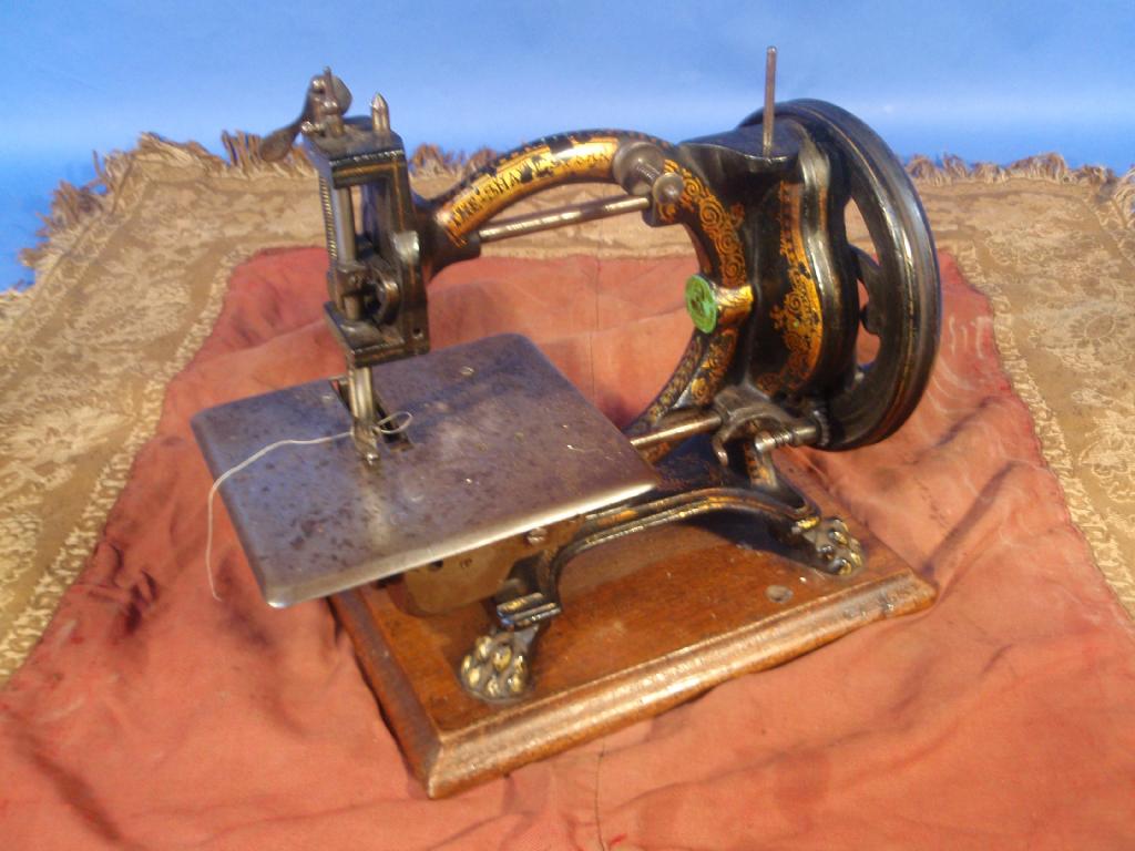 Appraisal: A Victorian The Shakespeare cast iron sewing machine and a