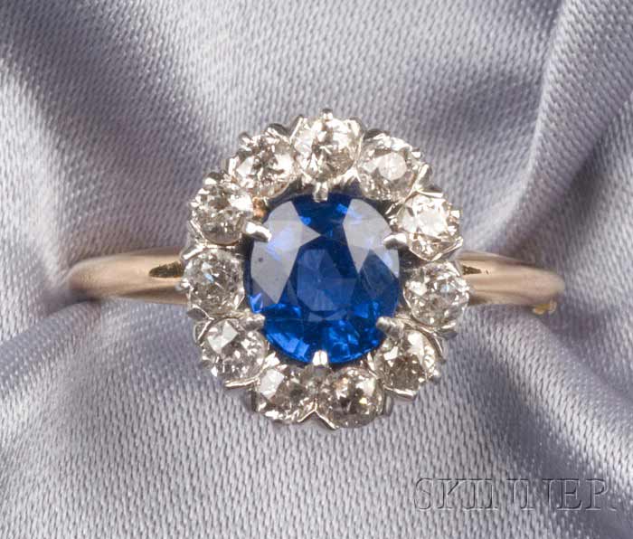 Appraisal: Edwardian Sapphire and Diamond Ring set with a cushion-shape faceted