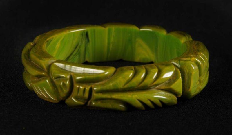 Appraisal: Bakelite Carved Bracelet with Oriental Figure Condition Excellent Size -