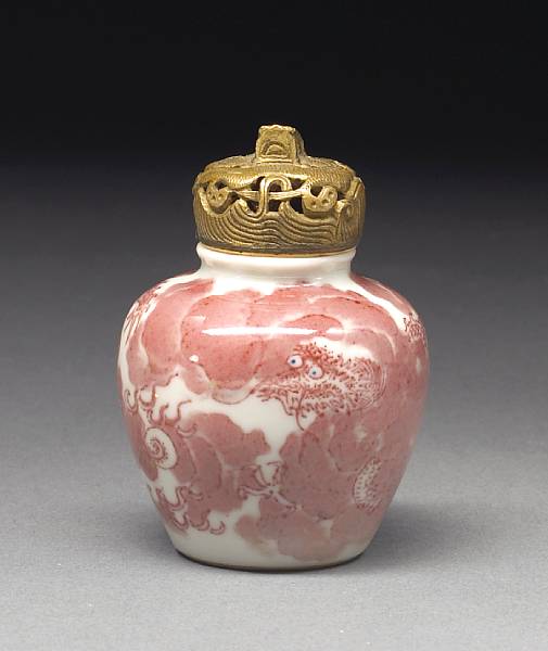 Appraisal: An iron red decorated porcelain snuff bottle th Century Of