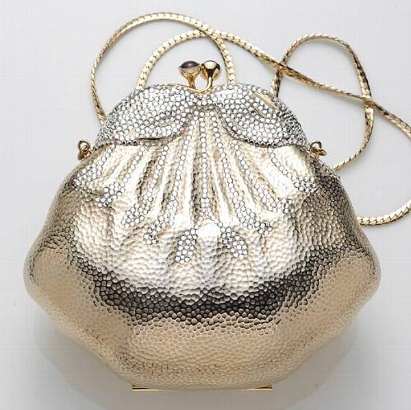 Appraisal: A metal and rhinestone purse Judith Lieber accompanied with signed