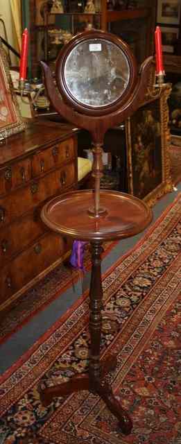 Appraisal: A VICTORIAN MAHOGANY SHAVING STAND the circular swing height adjustable