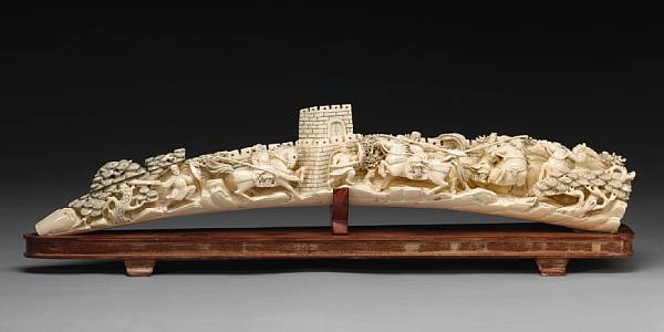 Appraisal: A carved ivory tusk th Century Undercut and carved in