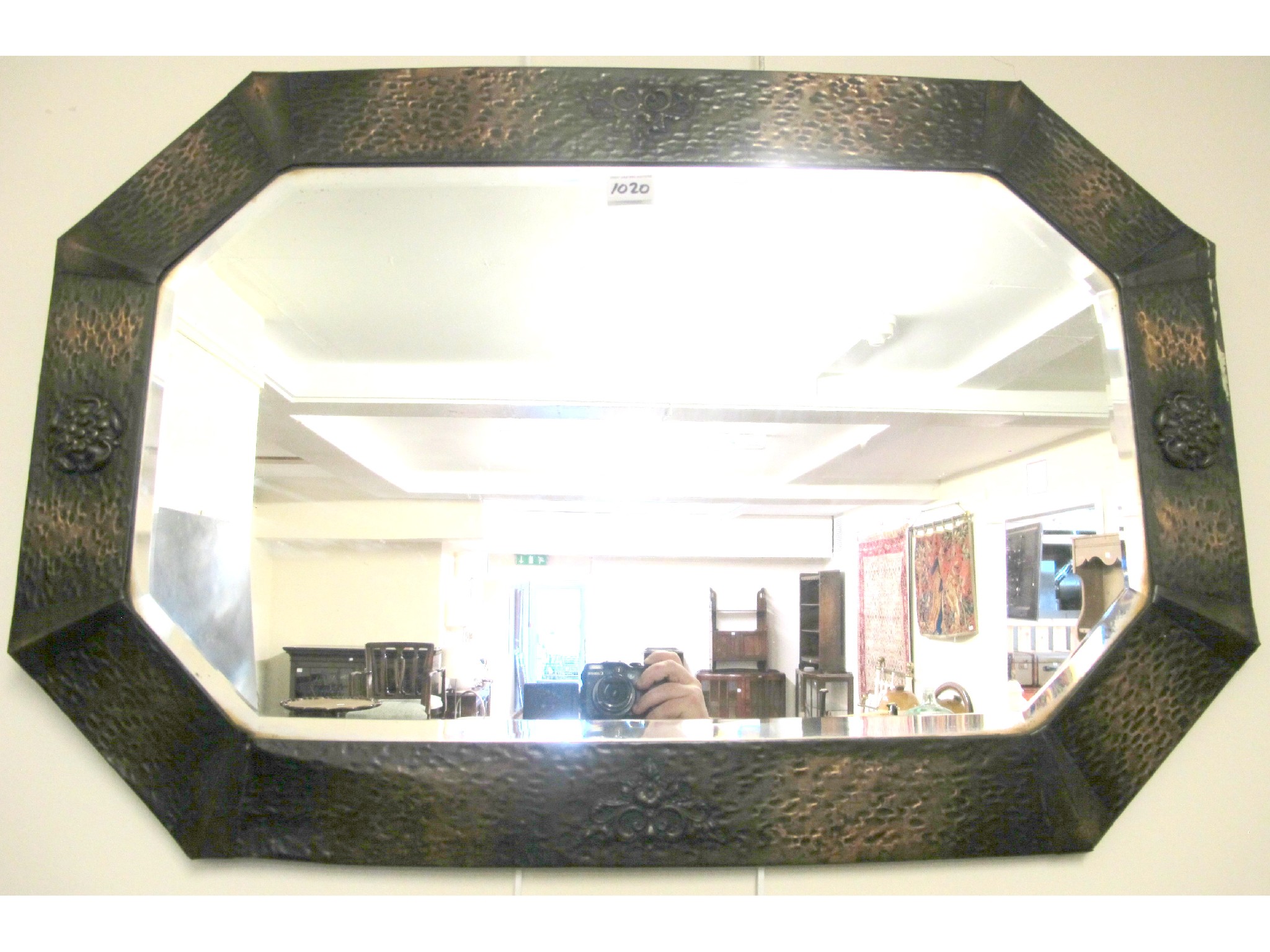 Appraisal: A copper bevelled glass mirror