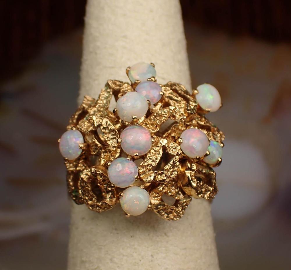 Appraisal: OPAL AND YELLOW GOLD OPENWORK RING The ring with an