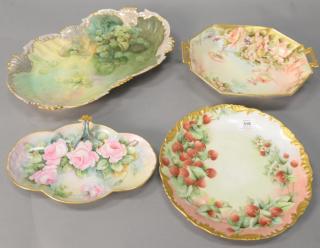 Appraisal: Four hand painted Limoges trays with flowers and strawberries two