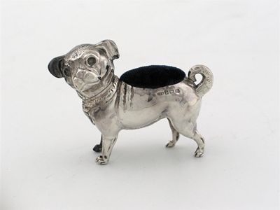 Appraisal: A pug dog pin cushion with turned head Birmingham in