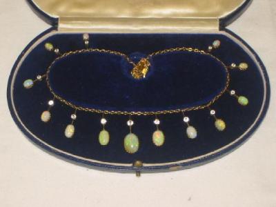 Appraisal: A VICTORIAN OPAL AND WHITE SAPPHIRE NECKLACE comprising thirteen graduated