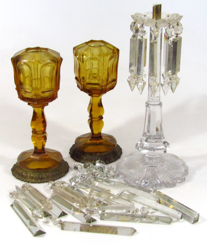 Appraisal: A pair of late thC early thC amber glass lamp