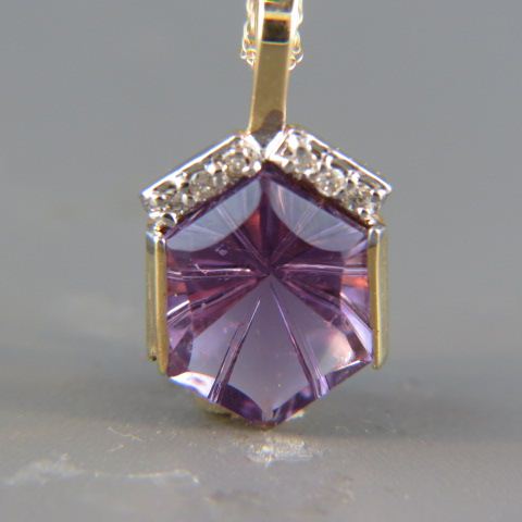 Appraisal: Amethyst Diamond Pendant indiant cut gem with six diamonds above