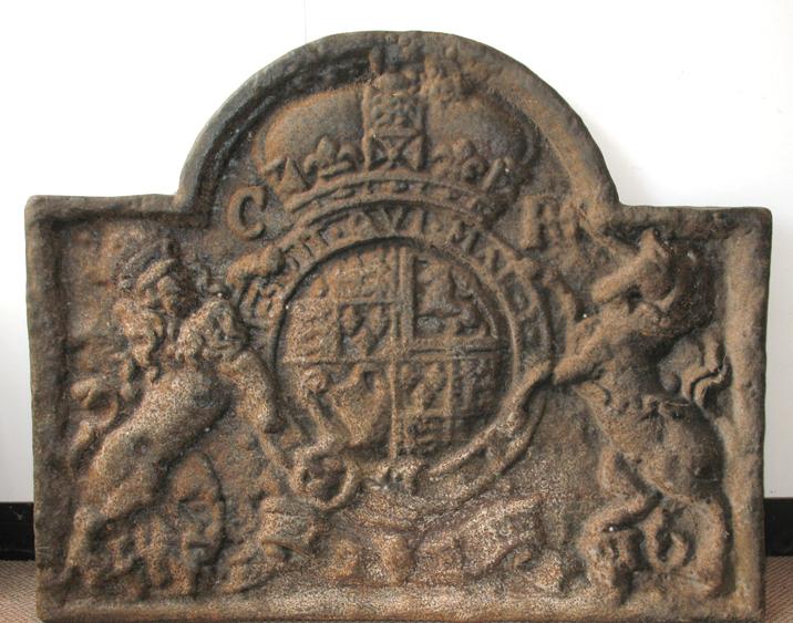 Appraisal: A CAST IRON FIRE BACK of rectangular form with an