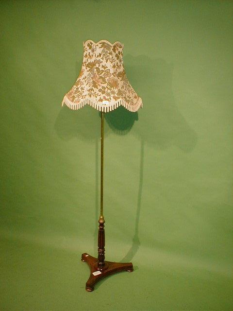 Appraisal: A Victorian rosewood pole screen stand with brass stem converted