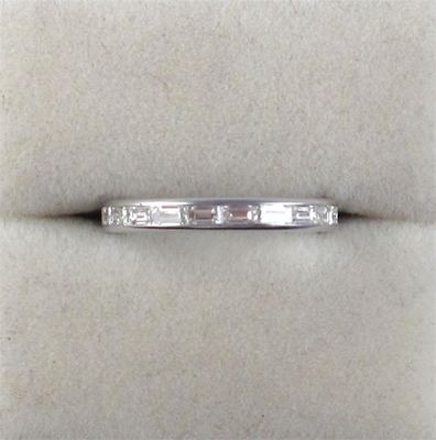 Appraisal: A diamond full circle eternity ring Set with baguette shaped