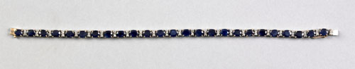 Appraisal: K yellow gold bracelet with twenty-five oval cut blue sapphires