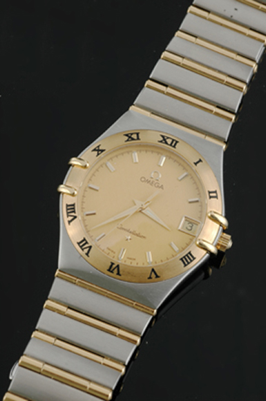 Appraisal: A Gents Omega Constellation wristwatch Quartz circular gold dial with