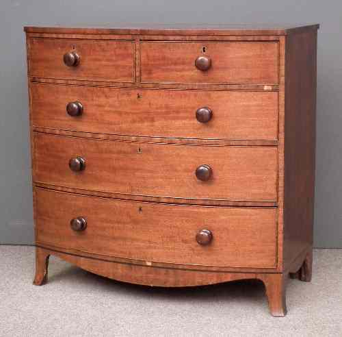 Appraisal: A late Georgian mahogany bow-front chest of drawers with square