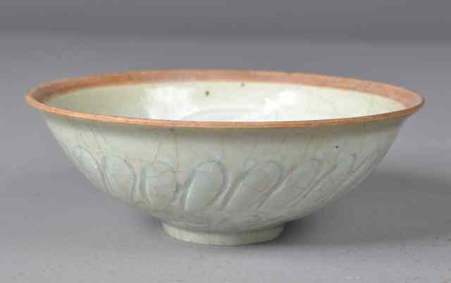 Appraisal: Chinese Celadon Footed Porcelain BowlPale green celadon finely carved to