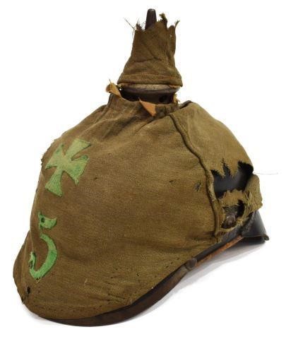 Appraisal: German pickelhaube helmet fitted with metal front plate depicting the