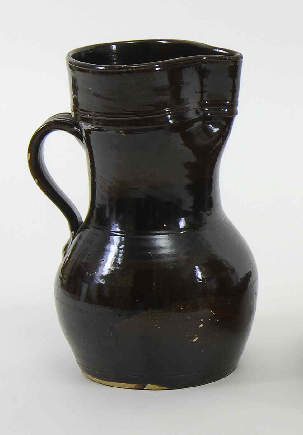 Appraisal: BROWN GLAZED STONEWARE SERVING PITCHERAmerican th CenturyHeight Provenance From the