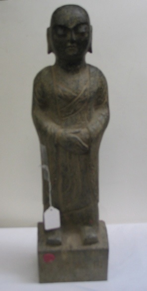 Appraisal: A CHINESE STONE SCULPTURE depicting a standing figure of Buddha