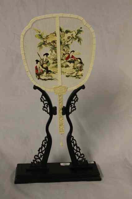 Appraisal: A CONTEMPORARY JAPANESE IVORY AND PAINTED FAN with open filigree