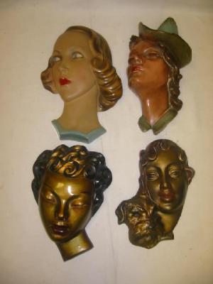 Appraisal: AN ART DECO PLASTER WALL MASK modelled as a lady