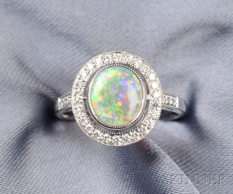 Appraisal: Platinum Opal and Diamond Ring set with an oval tablet