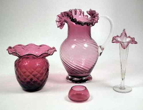 Appraisal: A Victorian cranberry glass bulbous jug with crimped rim and